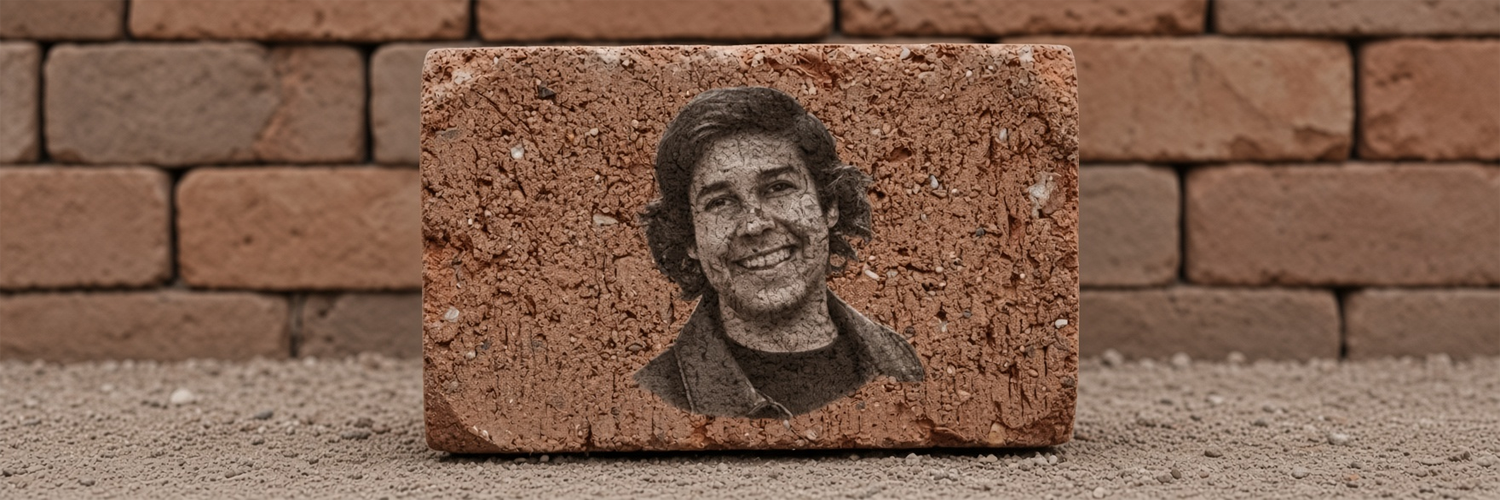 A portrait carved into a terracotta brick